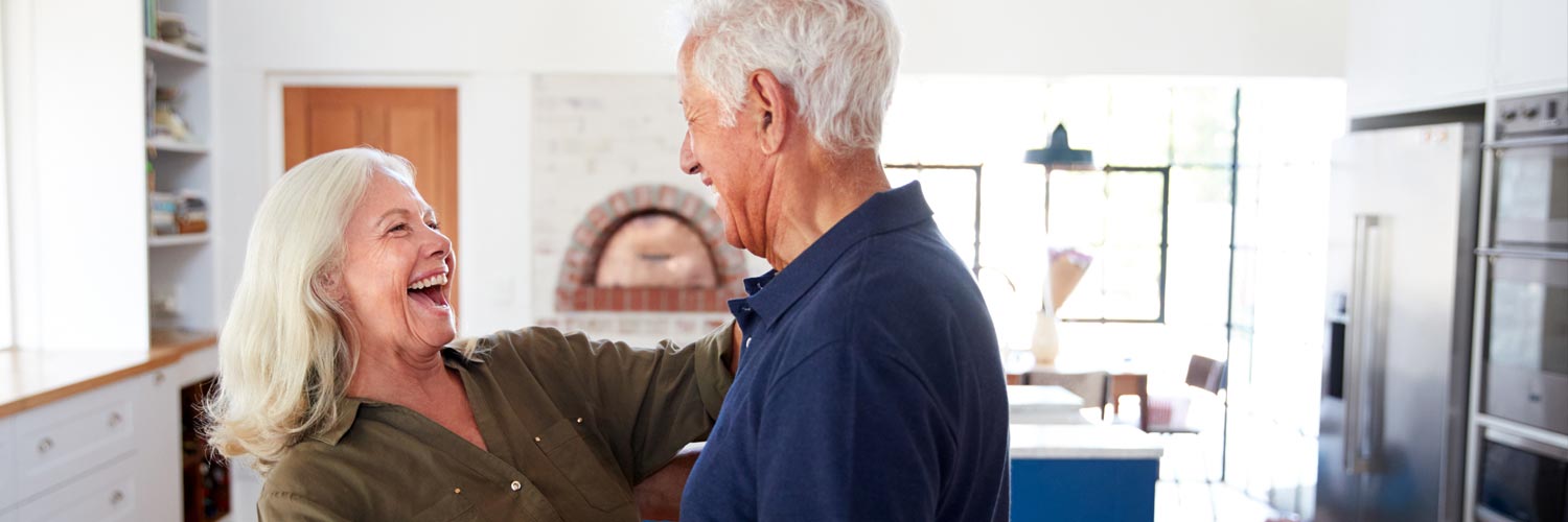 happy retired couple in home